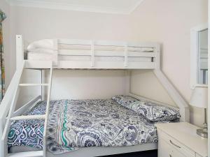 A bunk bed or bunk beds in a room at Sea Spray Apartments, Unit 1