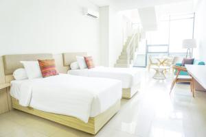 Postel nebo postele na pokoji v ubytování Skysuites Residence