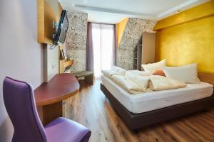 Postel nebo postele na pokoji v ubytování Flair Hotel Zum Schwarzen Reiter