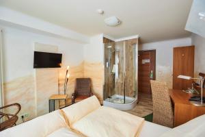 Postel nebo postele na pokoji v ubytování Flair Hotel Zum Schwarzen Reiter