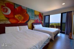 Postel nebo postele na pokoji v ubytování Sunny Ocean B&B