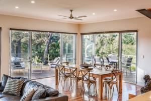 a dining room with a table and chairs at Glennishka in Margaret River Town