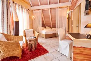 Postel nebo postele na pokoji v ubytování Flair Hotel Zum Schwarzen Reiter