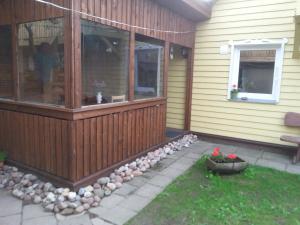 a front porch of a house with a window at Jurgvita in Palanga