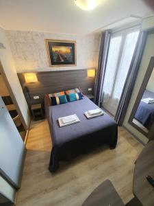 מיטה או מיטות בחדר ב-HOTEL SAVOY