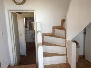 a staircase leading to the bathroom in a house at San Giorgio in Agios Georgios