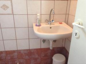 a bathroom with a sink and a toilet at San Giorgio in Agios Georgios