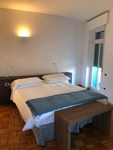 A bed or beds in a room at Albergo Del Sole