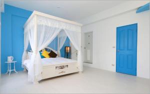 Łóżko lub łóżka w pokoju w obiekcie Chiaohsi Mediterranean Spa B&B