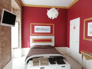 En eller flere senge i et værelse på Legendary Bay Suite Temática