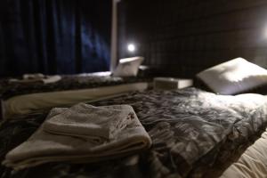 a room with two beds with towels on the bed at Apartment Rovakatu B12 in Rovaniemi