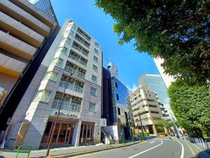 a city street with tall buildings and a road at Akasaka Urban Hotel in Tokyo