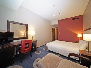 Postel nebo postele na pokoji v ubytování LOISIR HOTEL SHINAGAWA SEASIDE