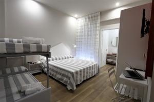 Postel nebo postele na pokoji v ubytování Hotel Aurea