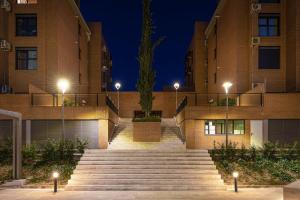 a set of stairs in front of a building at night at Premium Accomodation in La Rosaleda Area - Madrid in Madrid