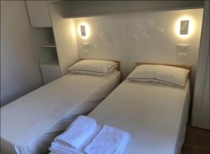 Säng eller sängar i ett rum på Camogli Eden - Luxury apartment