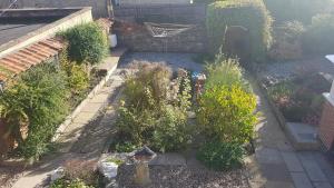an aerial view of a garden with a fire hydrant at Ruby Cottage in Irthlingborough