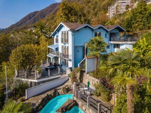 an aerial view of a blue house at CASA LUNA ALMA in Brione sopra Minusio