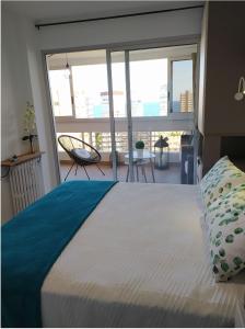 Un pat sau paturi într-o cameră la Playa Levante, recién reformado