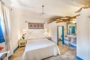 เตียงในห้องที่ Albergo Diffuso Mannois