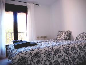 A bed or beds in a room at La Casa de los Abuelos Valentín