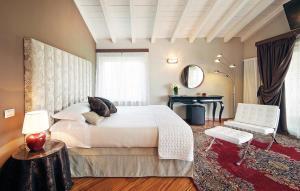 Postelja oz. postelje v sobi nastanitve Villa Archi B&B