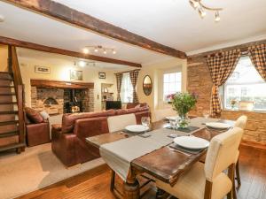 a living room with a table and a couch at Talworth in Brecon