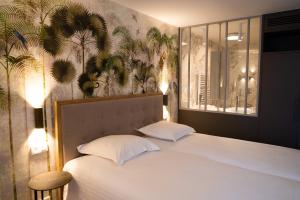 Postel nebo postele na pokoji v ubytování Hotel Iris