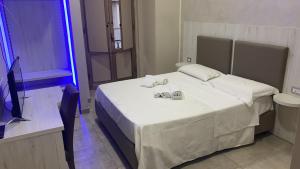 Łóżko lub łóżka w pokoju w obiekcie Hotel Poker