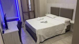 Łóżko lub łóżka w pokoju w obiekcie Hotel Poker