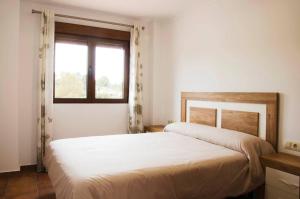 Cama o camas de una habitación en Las Palmeras Casa Rural