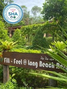 a sign for a long beach resort in the jungle at Fill - Feel @ Long Beach Resort in Ko Lanta