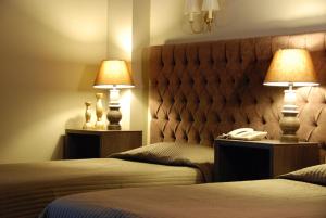 Postel nebo postele na pokoji v ubytování Hotel Doro City