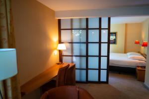 Postel nebo postele na pokoji v ubytování Hotel Iris