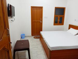 Letto o letti in una camera di Natraj Homes