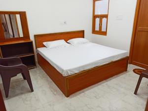 Letto o letti in una camera di Natraj Homes