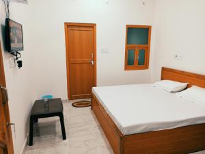 Letto o letti in una camera di Natraj Homes