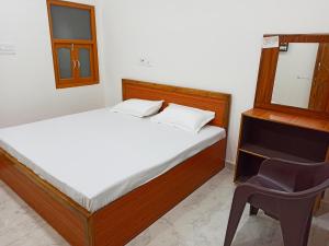Letto o letti in una camera di Natraj Homes