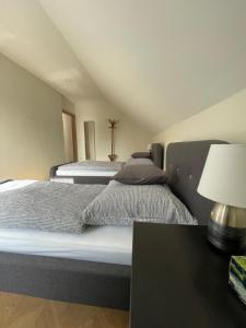 Postel nebo postele na pokoji v ubytování Koliko apartman