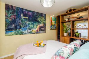 a bedroom with a bed with a tray of toys on it at Apartment City Getaway in Dubrovnik