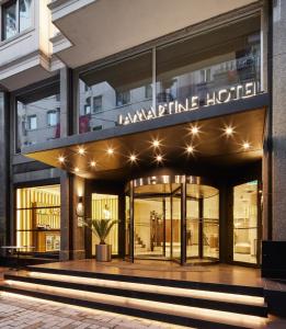 a store front of a luxury hotel with lights at Lamartine Hotel in Istanbul
