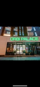 a building with a sign that reads urban palace at Orbi Palace, room 536 in Bakuriani