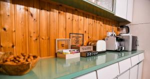 a kitchen counter with a bowl of food on it at Sophias Cottage in Askas
