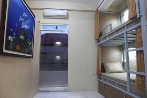 Palanda nebo palandy na pokoji v ubytování Aru House Ubud