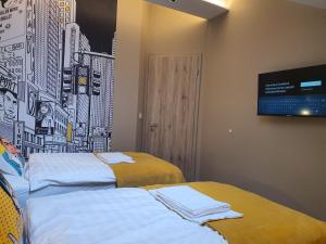 Postel nebo postele na pokoji v ubytování Kaposvár Apartman