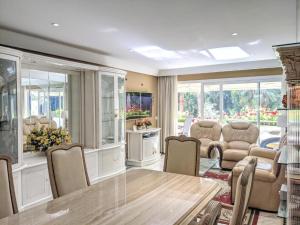 a large living room with a table and chairs at GRAN MARBELLA APARTMENTS by Coral Beach in Marbella