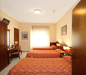 Letto o letti in una camera di Hotel Pavone