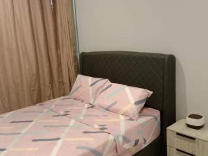 Llit o llits en una habitació de QC Homestay - Room Only