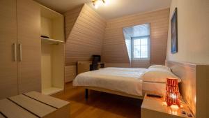 Postel nebo postele na pokoji v ubytování Hôtel du Cheval Blanc - City center