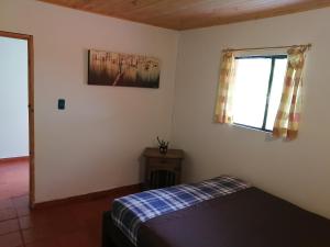 Postel nebo postele na pokoji v ubytování Nuestro Bosque I